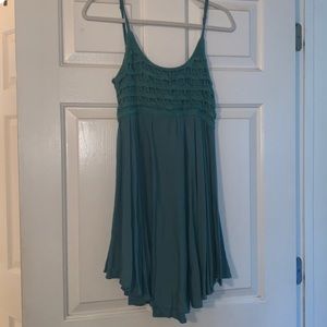 Green mini flowy dress with crochet detail